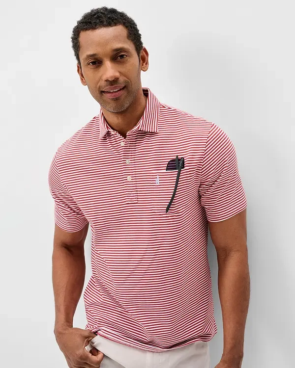 Man in a red-and-white striped Johnnie-O polo with sunglasses tucked in the chest pocket